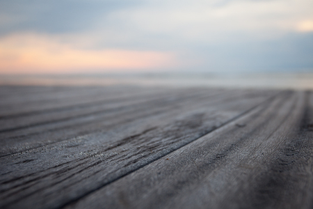 Close up old wooden flooring and tropical beachの写真素材