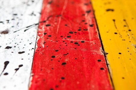 Patterned and textures background of brightly colored panels of weathered painted wooden boardsの写真素材