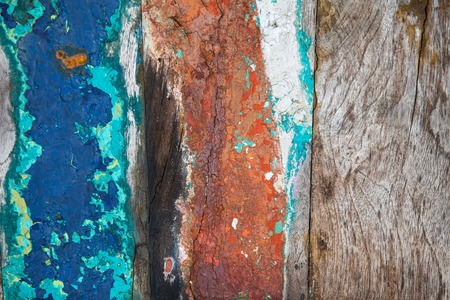 Patterned and textures background of brightly colored panels of weathered painted wooden boardsの写真素材