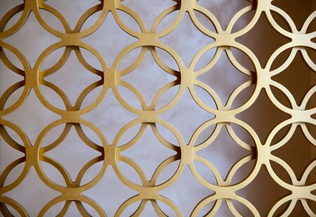 Orange painted circle perforated metal panels