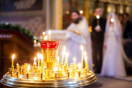 Burning candles on the background of weddings in the Orthodox Churchの写真素材