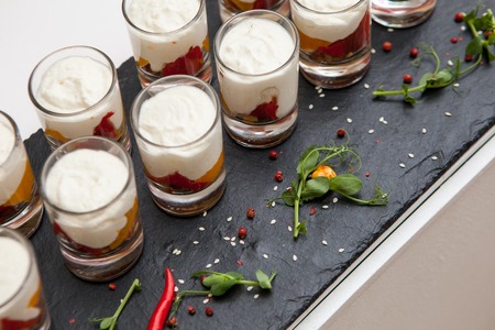 Catering bowls with dessert and cinnamon, a variety of snacks and treatsの写真素材