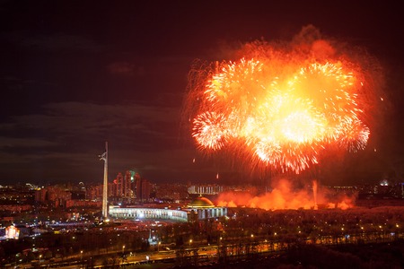 Bright fireworks explosions in night sky above Victory Park in Moscow, Russiaの写真素材