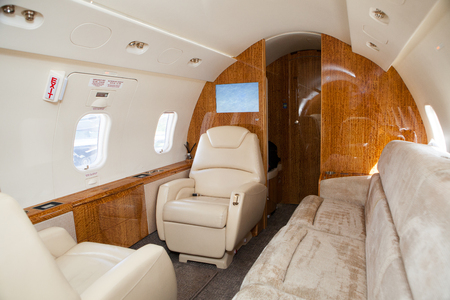 Interior in bright colors of genuine leather in the business jetの写真素材