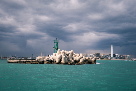 Lighthouse in a cloudy day with a storm approachingの写真素材