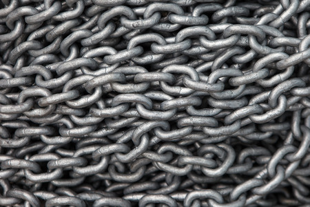 Large piles of steel chain connected the backgroundの写真素材