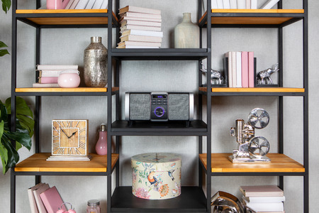 Compact CD radio player on the shelf in the vintage interior of the living roomの写真素材