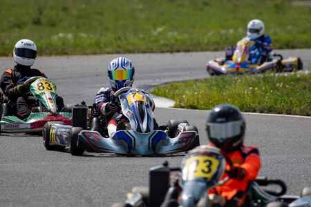 Unidentified pilots compete on the Atron track in the Rotax max Cup RAF series of sports karting, track raceのeditorial素材