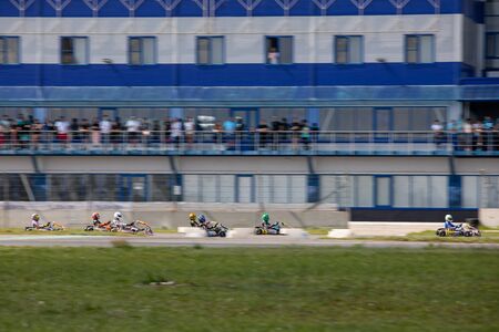 Unidentified pilots compete on the Atron track in the Rotax max Cup RAF series of sports karting, track raceのeditorial素材