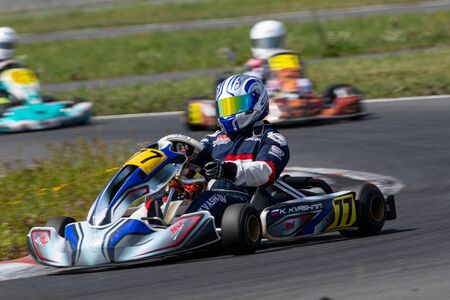 Unidentified pilots compete on the Atron track in the Rotax max Cup RAF series of sports karting, track raceのeditorial素材