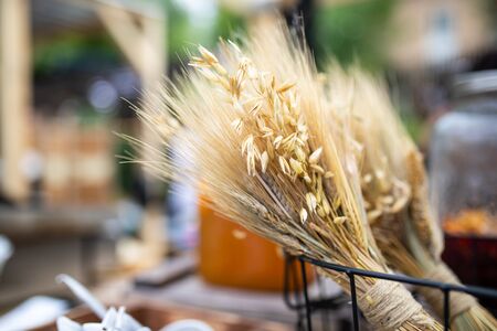 Bouquet of Mature oats and wheat ears , decoration at the farmers market, great depth of fieldの写真素材