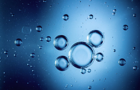 Bubbles in water on a blue background. Shallow depth of fieldの写真素材