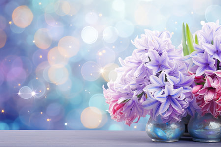 delicate background with shimmering sequins. hyacinths on the table in vases, pots. Space for text. A template for a greeting card.の素材