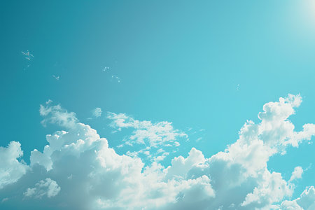 clouds float against the background of a blue sky. place for the textの素材