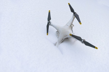 The crashed Drone. Fallen in snow.の写真素材