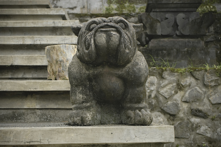 Cute and funny Bulldog sculpture. Statue guardian dogの写真素材