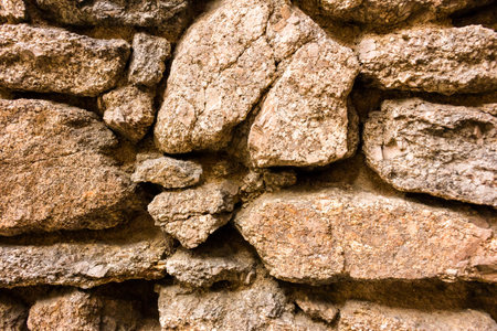 Background of stone wall texture. Old stone wall texture. Stone wall backgroundの写真素材