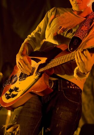 Musician with electric guitar on festival