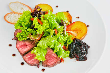 steak grilled to perfection and served with vegetablesの写真素材