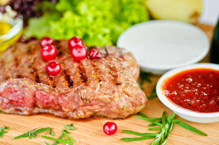 steak grilled to perfection and served with vegetablesの写真素材