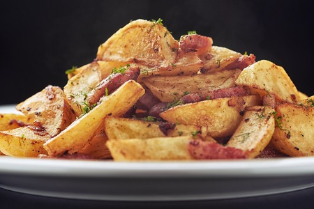 Roasted smokie potatoes with bacon and mushroomsの写真素材