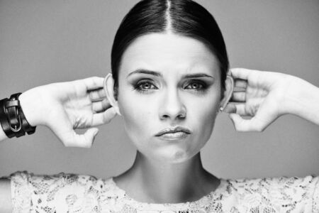 Black and white emotional portrait of a beautiful fashion girl, sweet and sensual.の写真素材