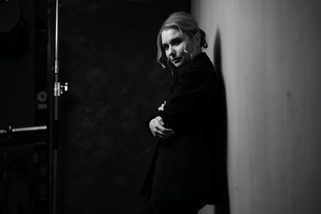 Black and white portrait of a beautiful woman on a dark backgroundの写真素材