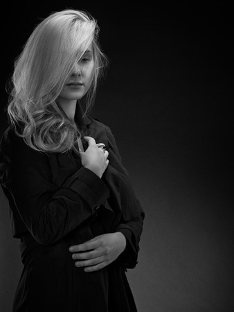Classic cinematicblack  white woman portrait on a black backgroundの写真素材