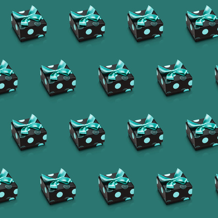 Abstract green illustration with diagonal lines of similar gift boxes tied ribbons and bows. Lots of presents. Can be used like background for Easter, Saint Patricks, Thanksgiving, Mothers days.の写真素材