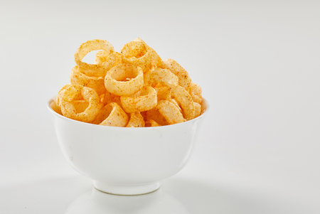 Tasty and spicy snacks on whiteの写真素材
