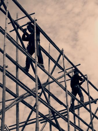 Bamboo Scaffolding -- with two men at work, vintage imageの写真素材