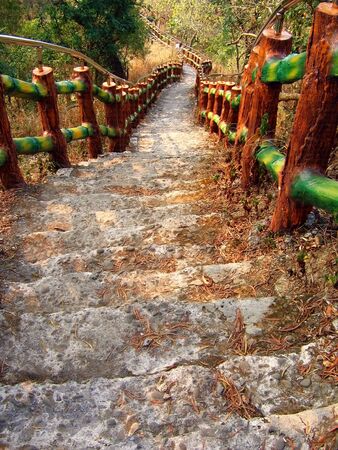 Steep Climb -- old stone steps leading up to a mountain topの写真素材