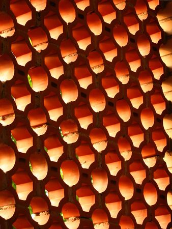 Lattice Brick Wall -- with the light shining through the openingsの写真素材