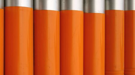 Drainage Pipes -- made out of orange PVC, with metal capsの写真素材