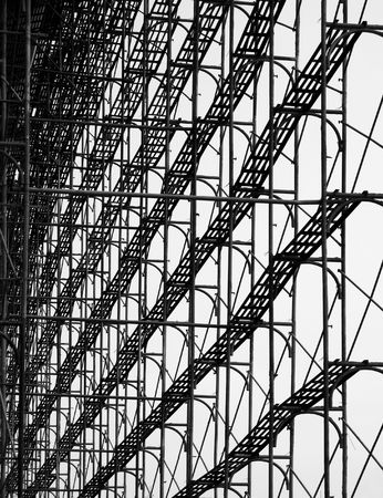 Construction Scaffolding -- seen as a silhouette with walkways and cross beamsの写真素材