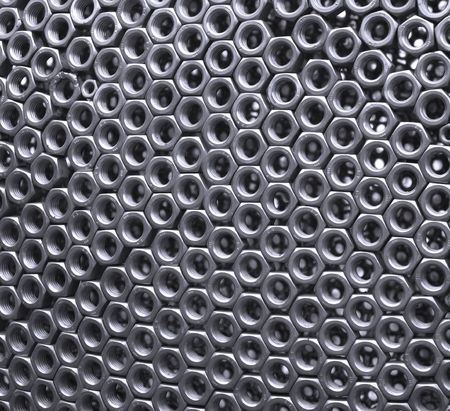 Plenty of Nuts -- a wall made of hexagonal steel toolsの写真素材