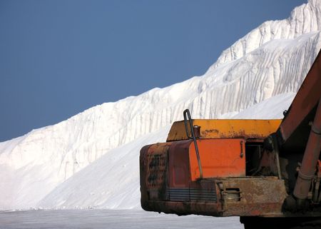 Salt Production -- a large mountain of salt and equipmentの写真素材