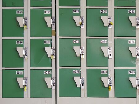 Row of Lockers -- the Chinese writing instructs the user to deposit a 10 Taiwan dollar coinの写真素材