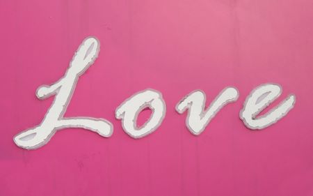 Love Sign -- an old outdoor sign with the word Love on itの写真素材
