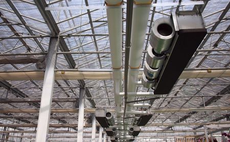 The inside view of a modern greenhouse with equipment for climate controlの写真素材