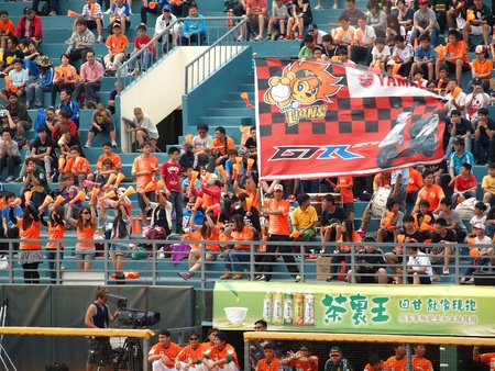 PINGTUNG, TAIWAN, APRIL 8: Fans are cheering for the President Lions in a Pro Baseball League game against the Lamigo Monkeys. The Lions won 2:0 on April 8, 2012 in Pingtung. のeditorial素材