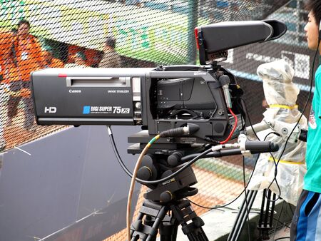 A high definition camera records a sporting event for televisionのeditorial素材