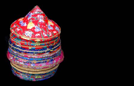 Traditional Chinese straw hats covered with colorful clothの写真素材