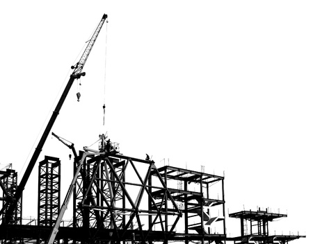 Construction site with crane and scaffolding seen as a silhouette
の写真素材