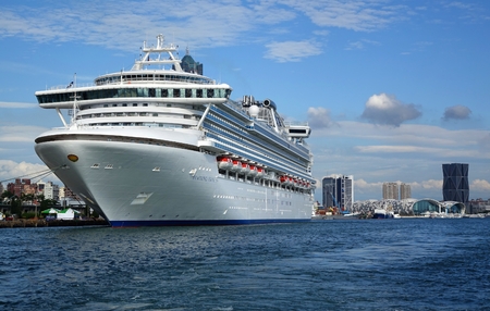 KAOHSIUNG, TAIWAN -- MAY 11, 2014:  The gem class cruise ship Diamond Princess docks at Kaohsiung Port. In the back you can see the new exhibition center and the trade tower.のeditorial素材