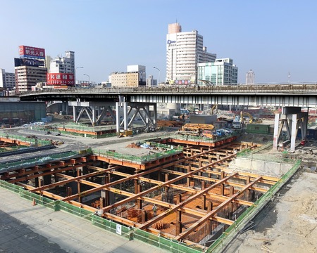 KAOHSIUNG, TAIWAN -- NOVEMBER 2, 2014:  A large underground construction project outside Kaohsiung Railway Station, that is part of the new light rail system.のeditorial素材