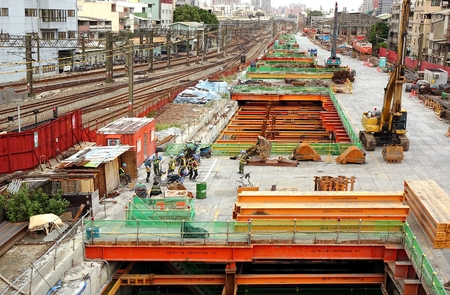 KAOHSIUNG, TAIWAN -- AUGUST 15, 2015: Large scale construction work continues on the project to move the city rail tracks underground.のeditorial素材