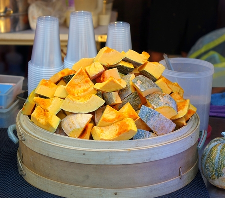 A street vendor sells shakes made from freshly cooked squashの写真素材