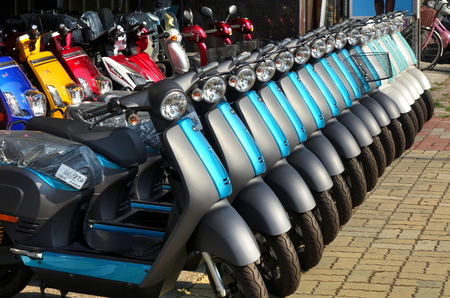 KAOHSIUNG, TAIWAN -- MAY 12, 2018: To phase out gasoline scooters the switch to electric scooters is encouraged. Here is a line up of brand new electric scooters for sale.のeditorial素材
