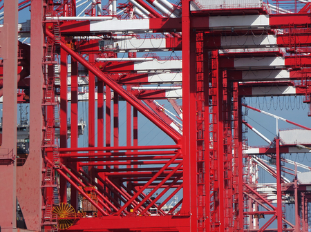 A row of large cranes used for loading containers on to shipsの写真素材
